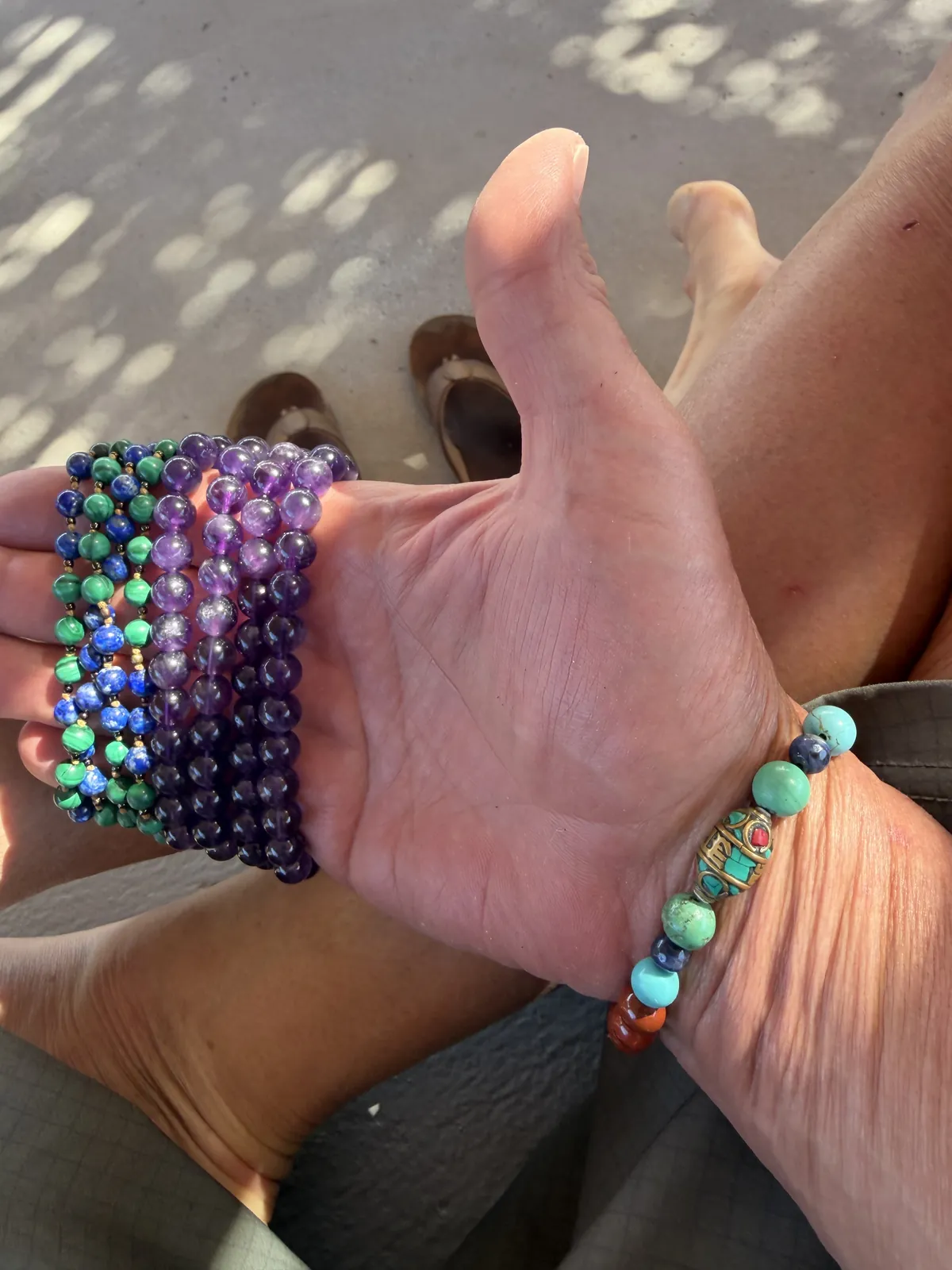 Mala beads held in an open hand