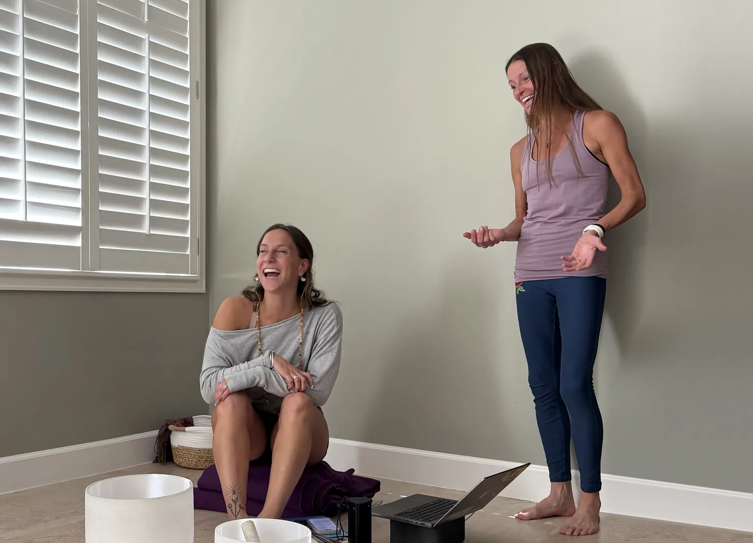Rachel Cieslewicz coaching a new teacher at the YogaSoul shala