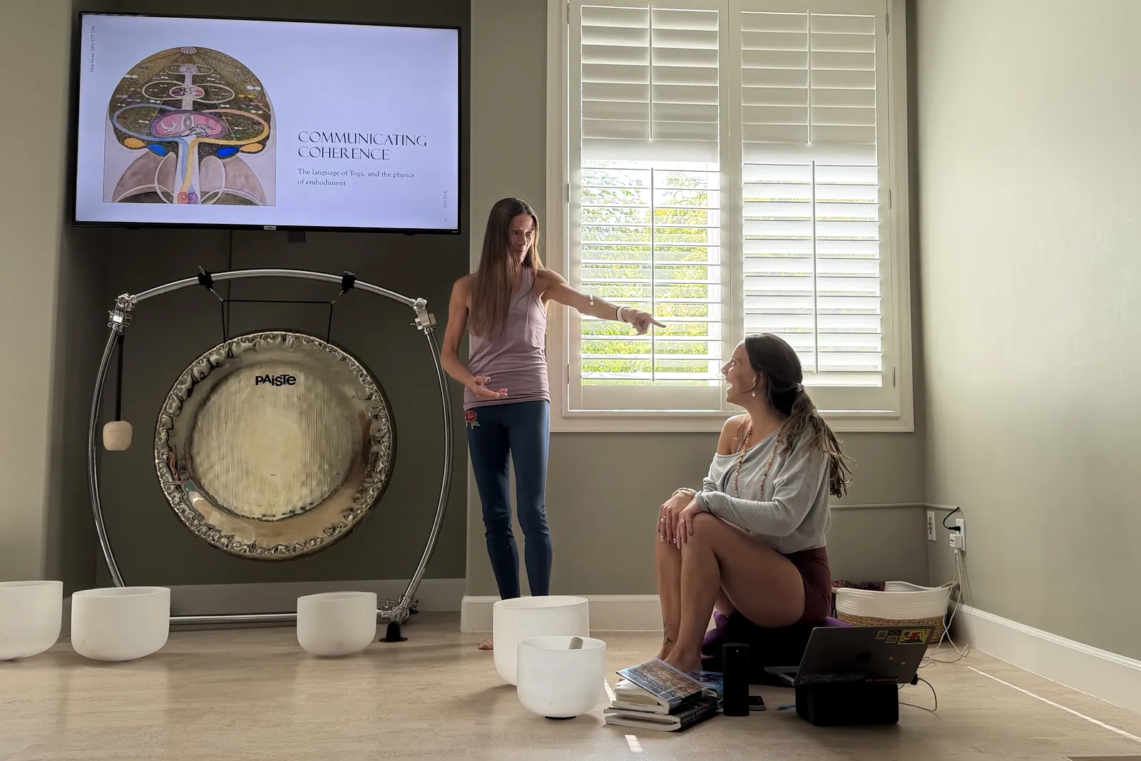 Rachel Cieslewicz teaching a teacher training session beside the gong at the YogaSoul shala in Salt Lake City