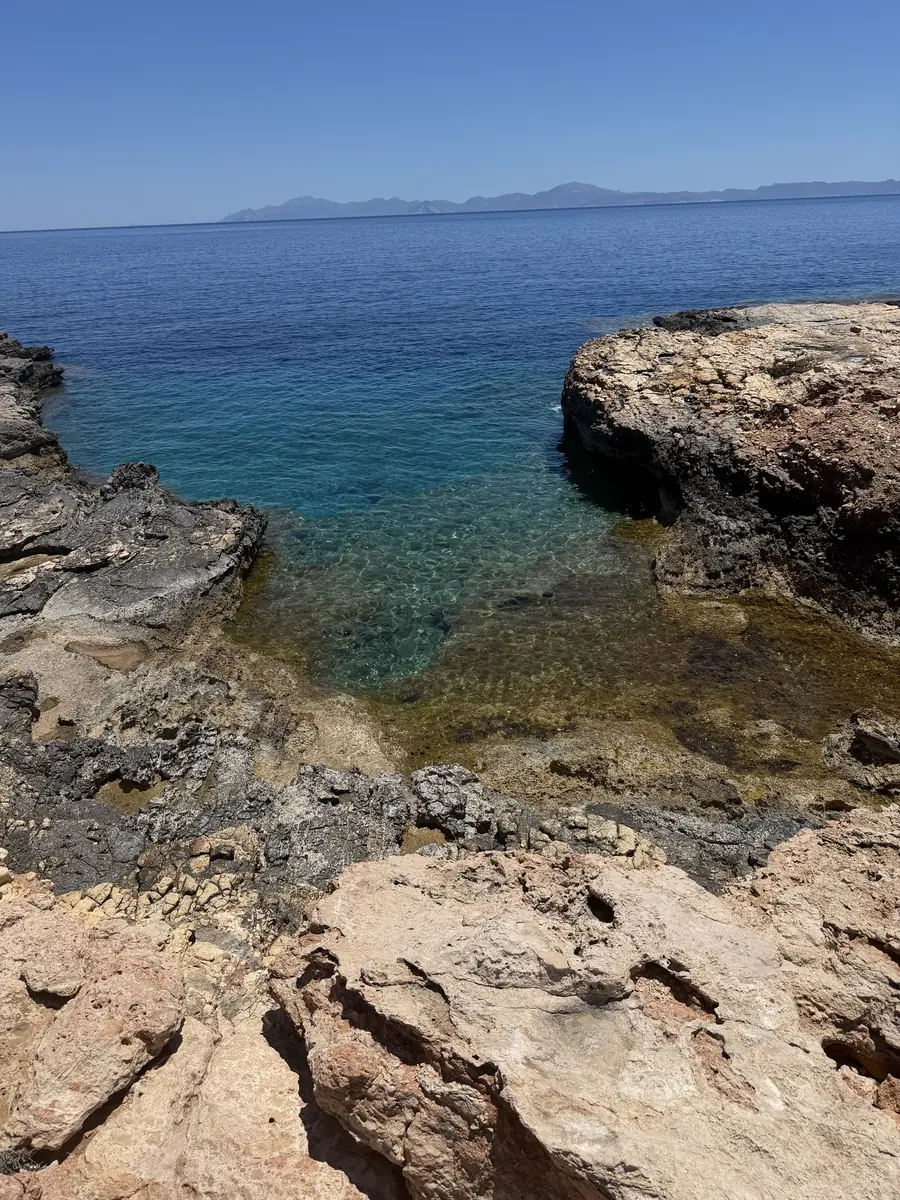 A guest looking out from the cliffs above the Aegean, Koufonisia