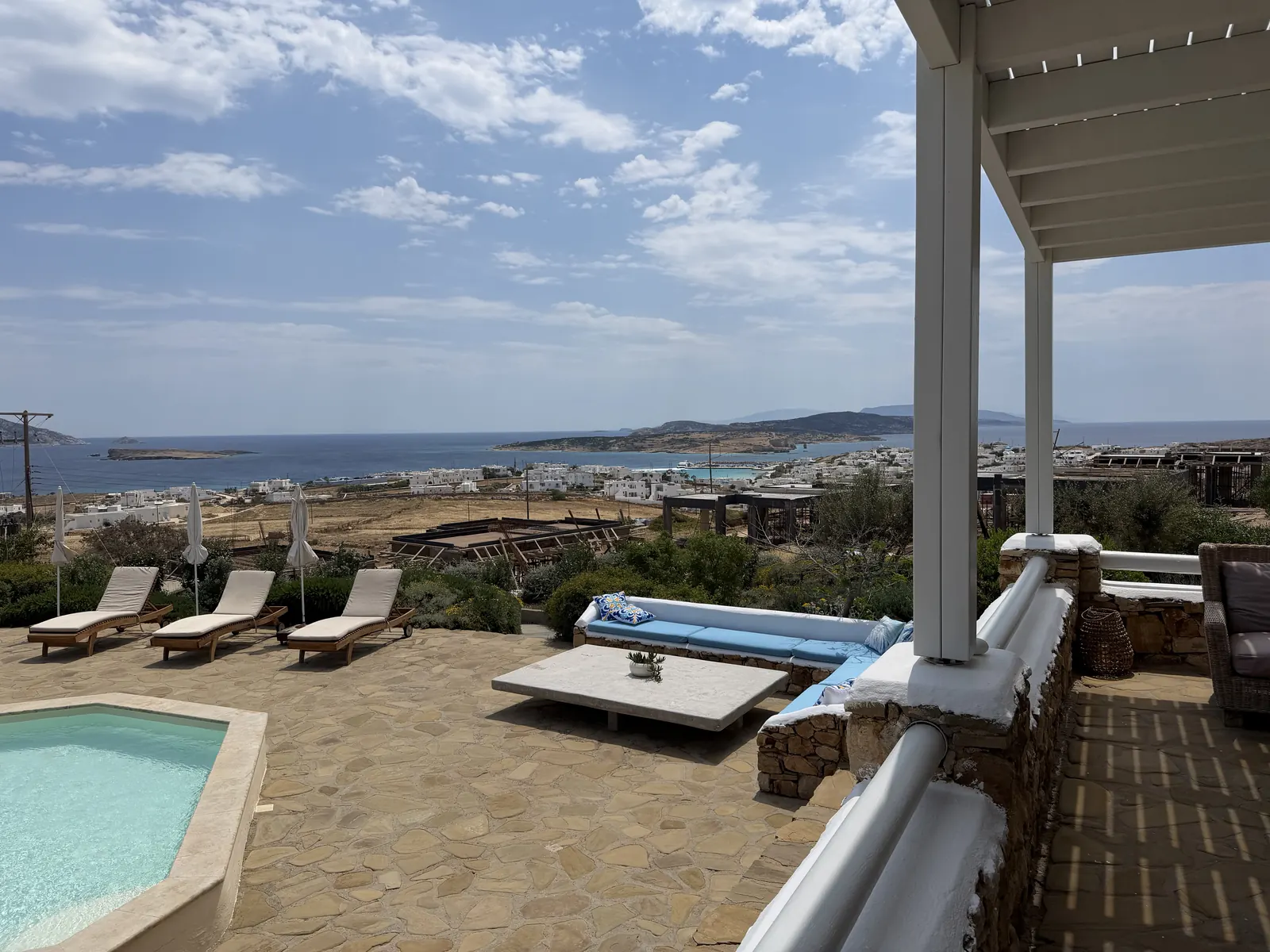 The hot tub and sun loungers on the estate terrace, looking out to the sea