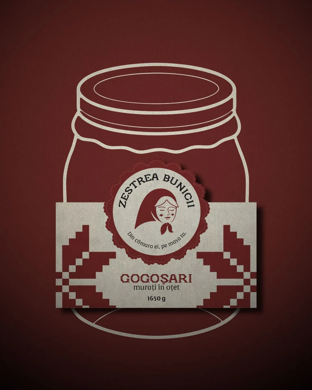 Zestrea Bunicii label presentation for Gogoșari murați în oțet 1650 g: the cream label with a burgundy cross-stitch border and the grandmother badge, over a jar outline on burgundy.