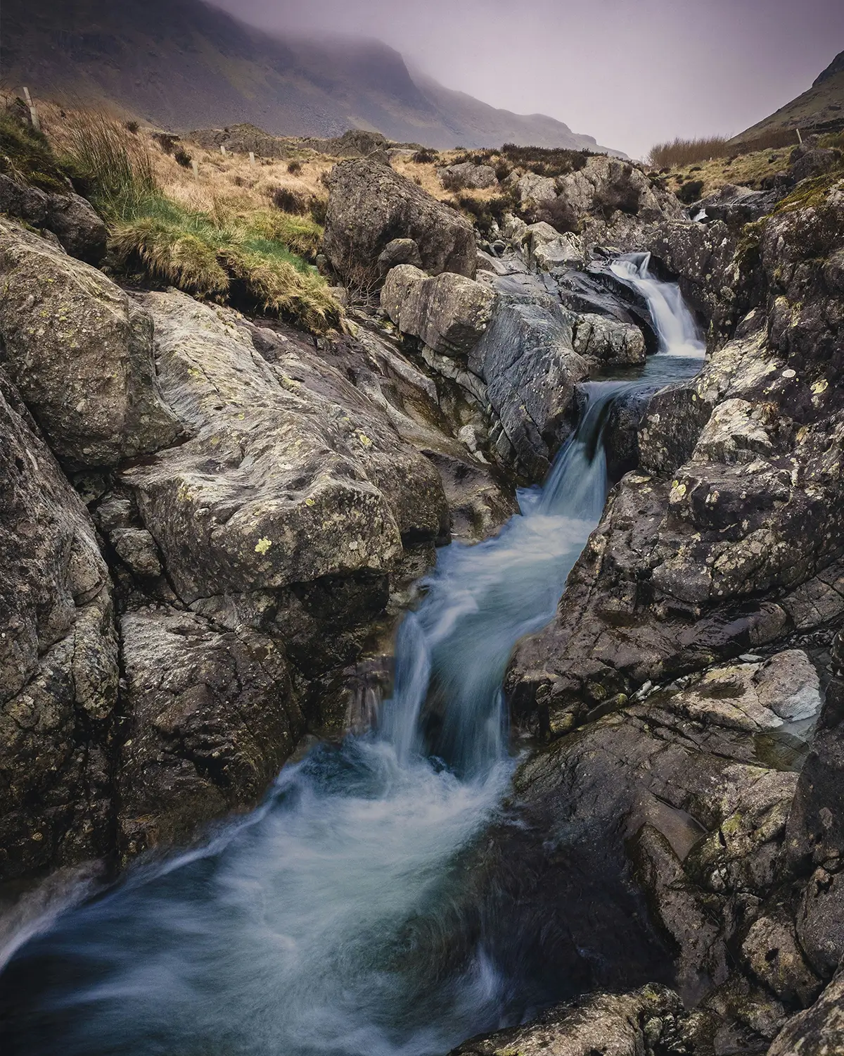 Waterfall flowing through a rocky gorge on the Isle of Skye