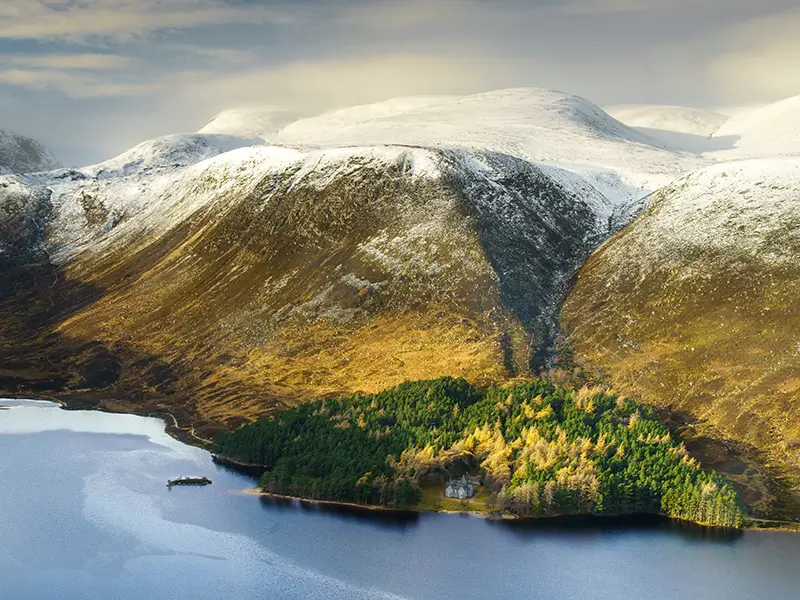 Mountain landscape and loch in the Cairngorms National Park