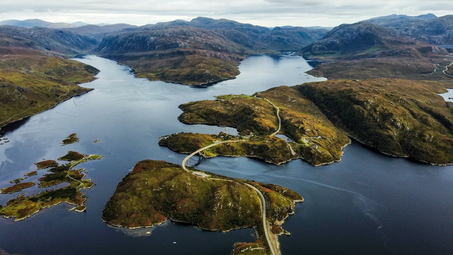 Aerial view of islands and coastline along Scotland's North Coast 500 route