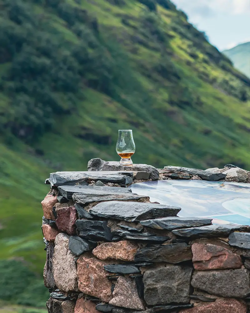 Stone viewpoint overlooking a glen in Speyside, Scotland