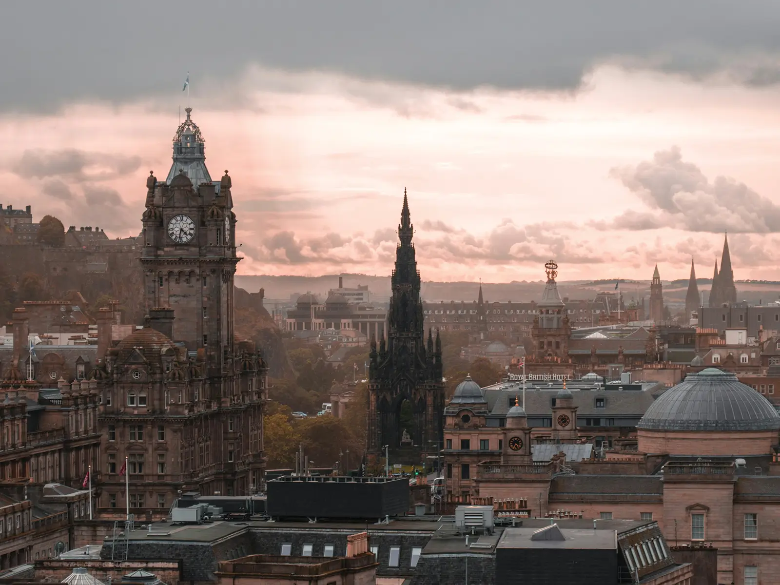 Edinburgh city skyline at sunset with historic architecture