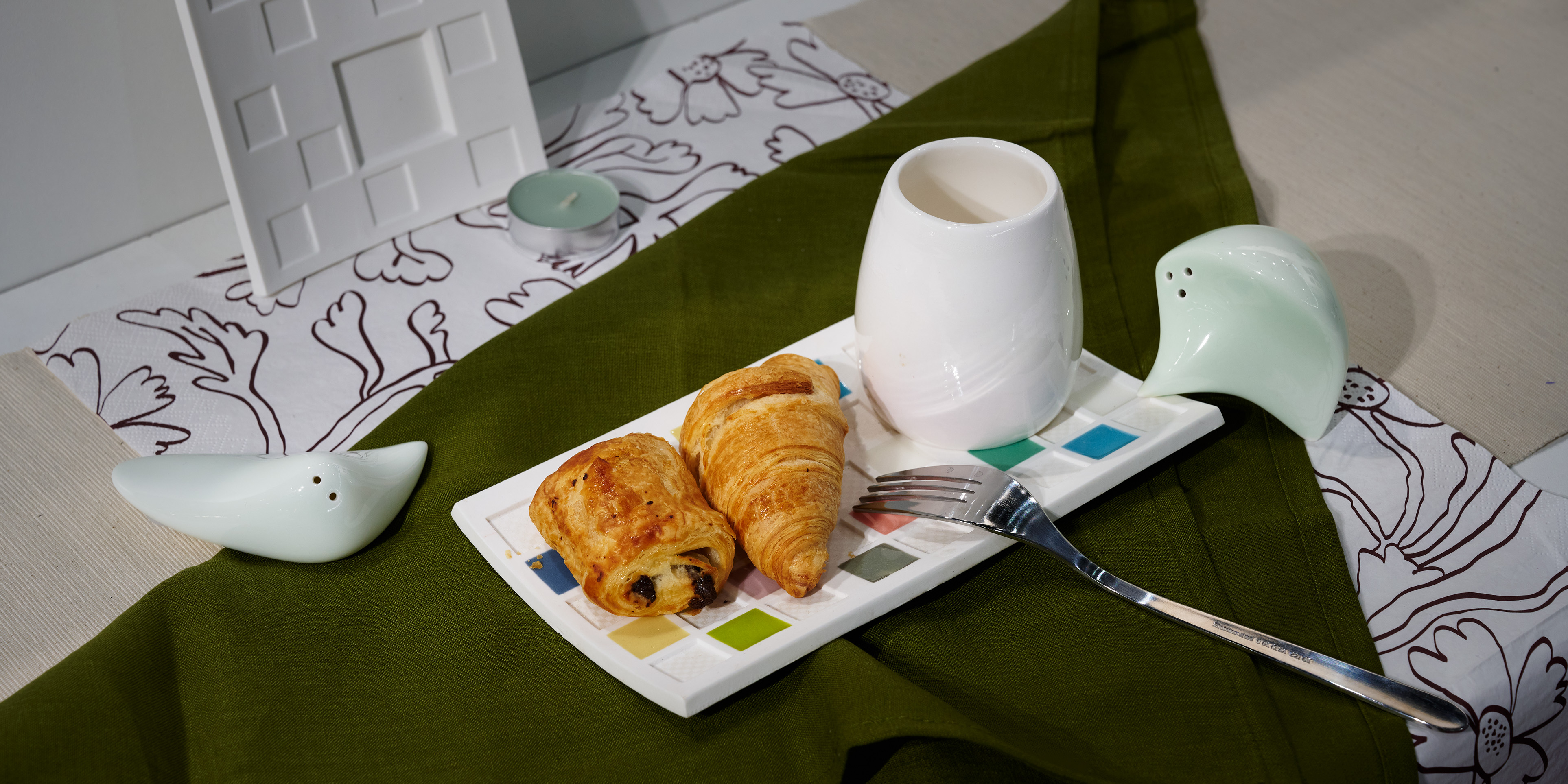 Mosaic tableware arranged together, including Small Plate and Egg Cup. Pieces sold separately.