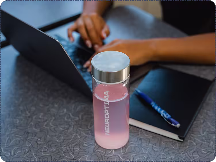 Flowstate drink beside a laptop during a study session