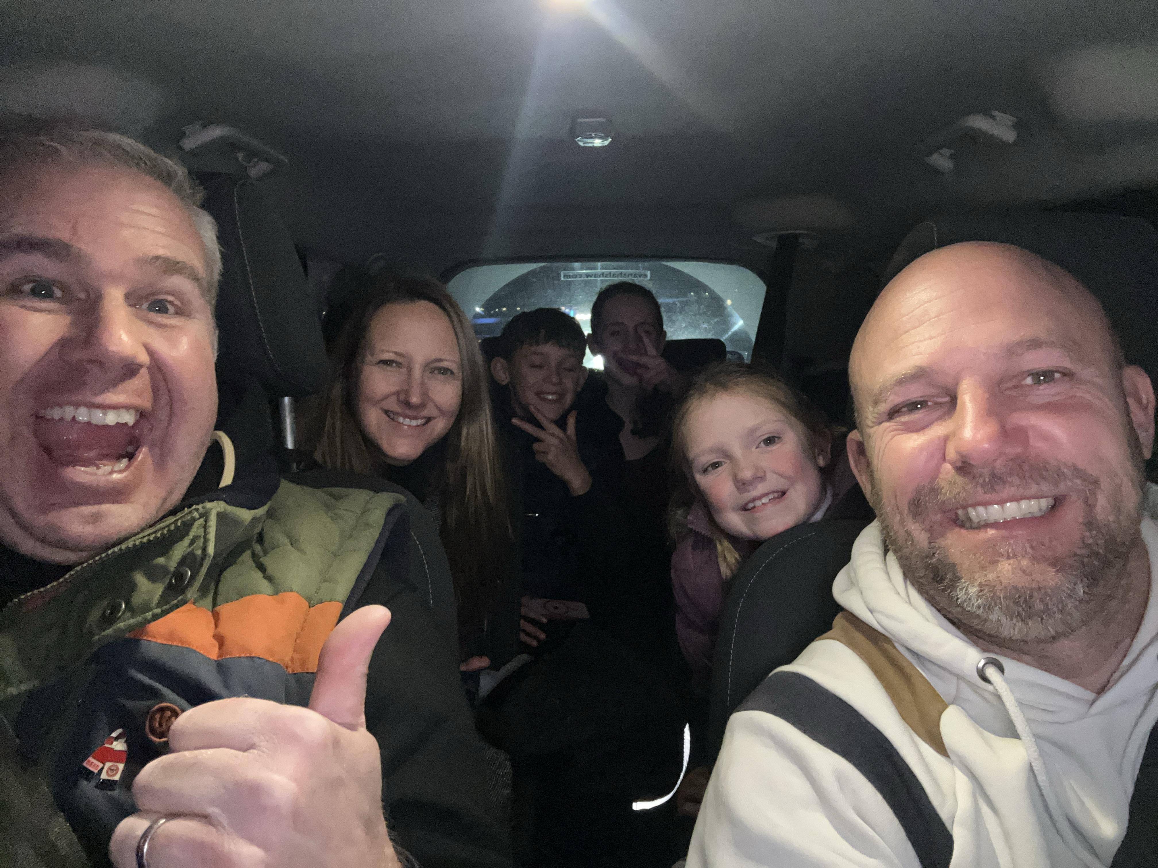 A family plays ReadySet from within their car while experiencing the Silverstone Lap of Lights