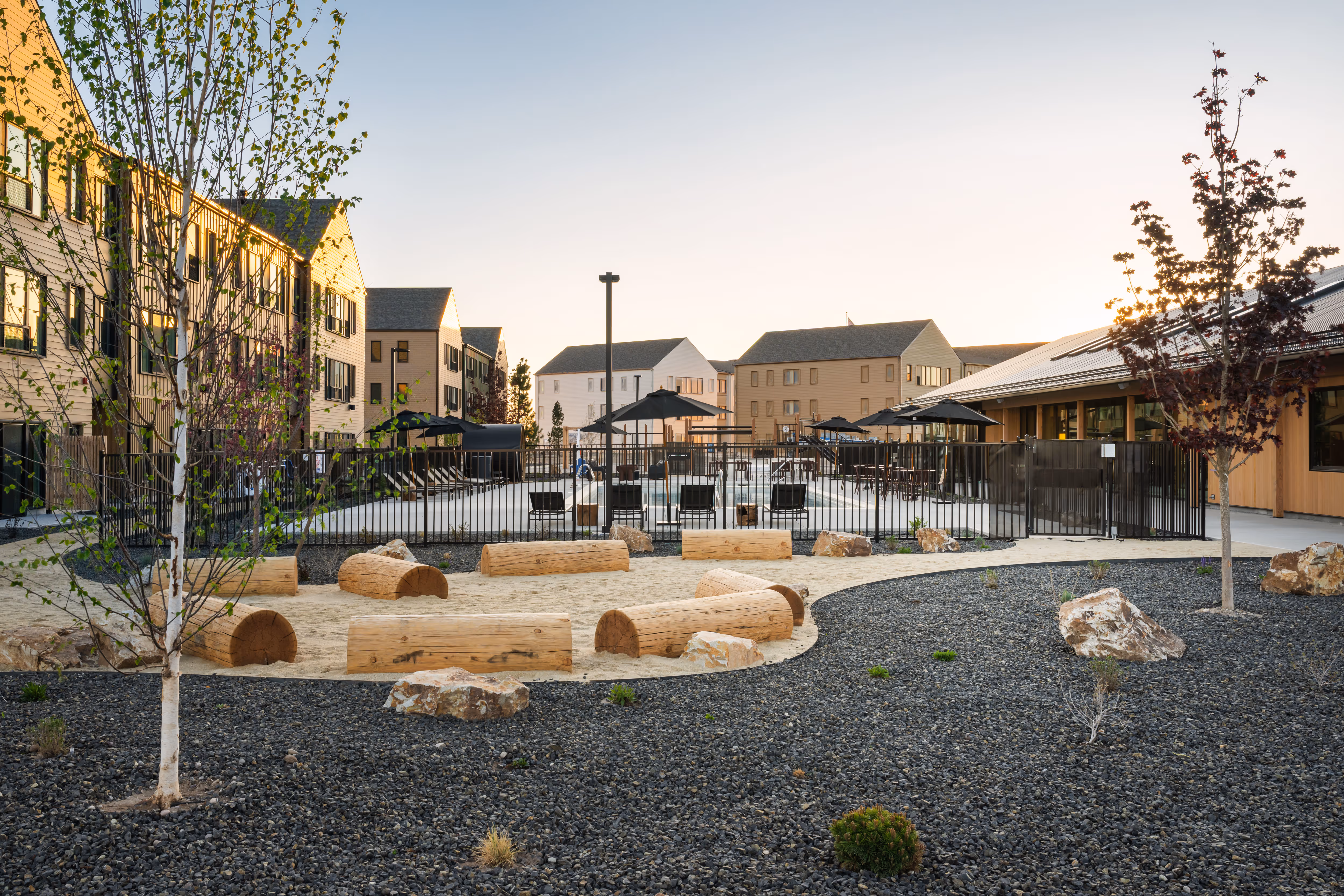 Photo of the walking paths and pool outside of the Cloudveil apartments Clubhouse
