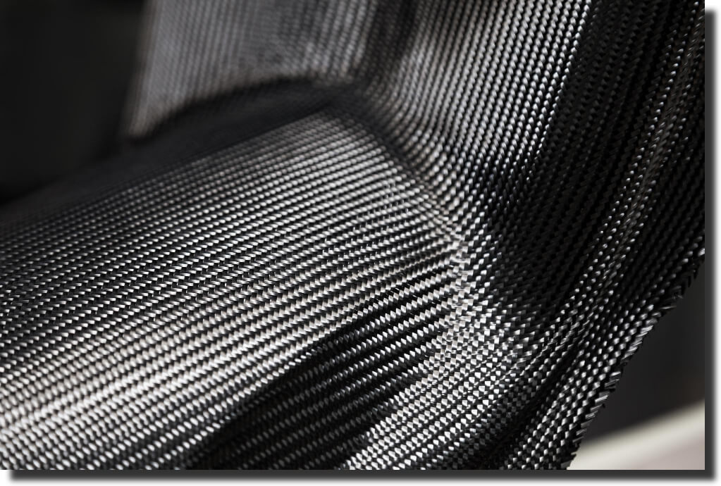 MCarbon fiber fabric draped over a complex contour; example of composite tooling materials shaped via advanced composite tooling design.