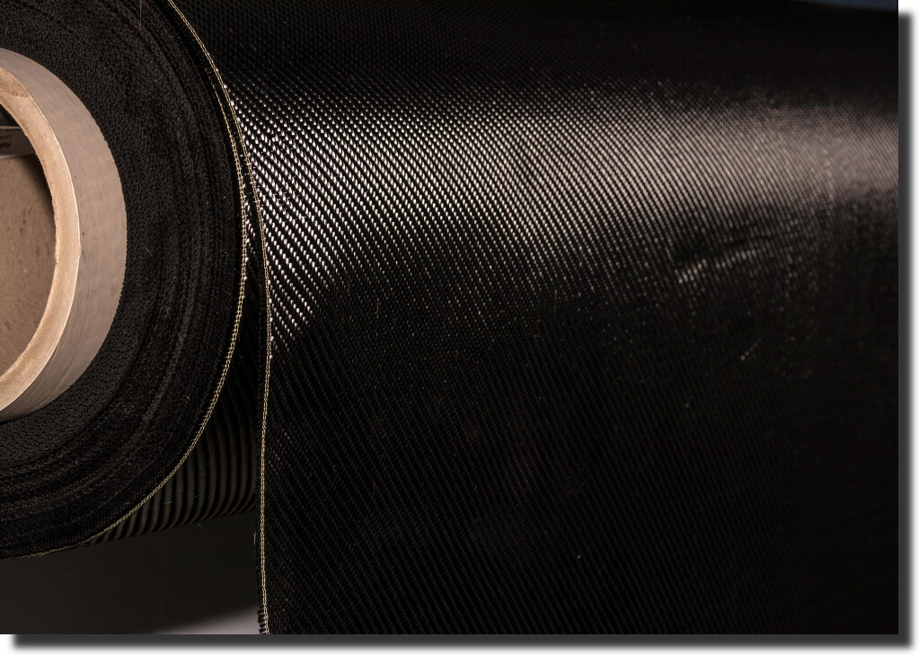 Roll of black carbon fabric ready for kit‑cutting; core composite tooling material for autoclave‑ready molds and fixtures.
