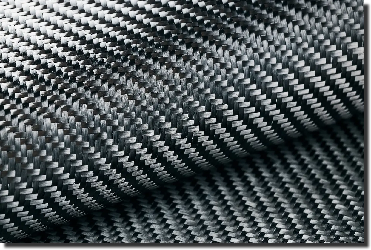 Curved carbon fiber fabric with pronounced weave pattern, showing how carbon fiber composite modulus of elasticity changes with geometry.