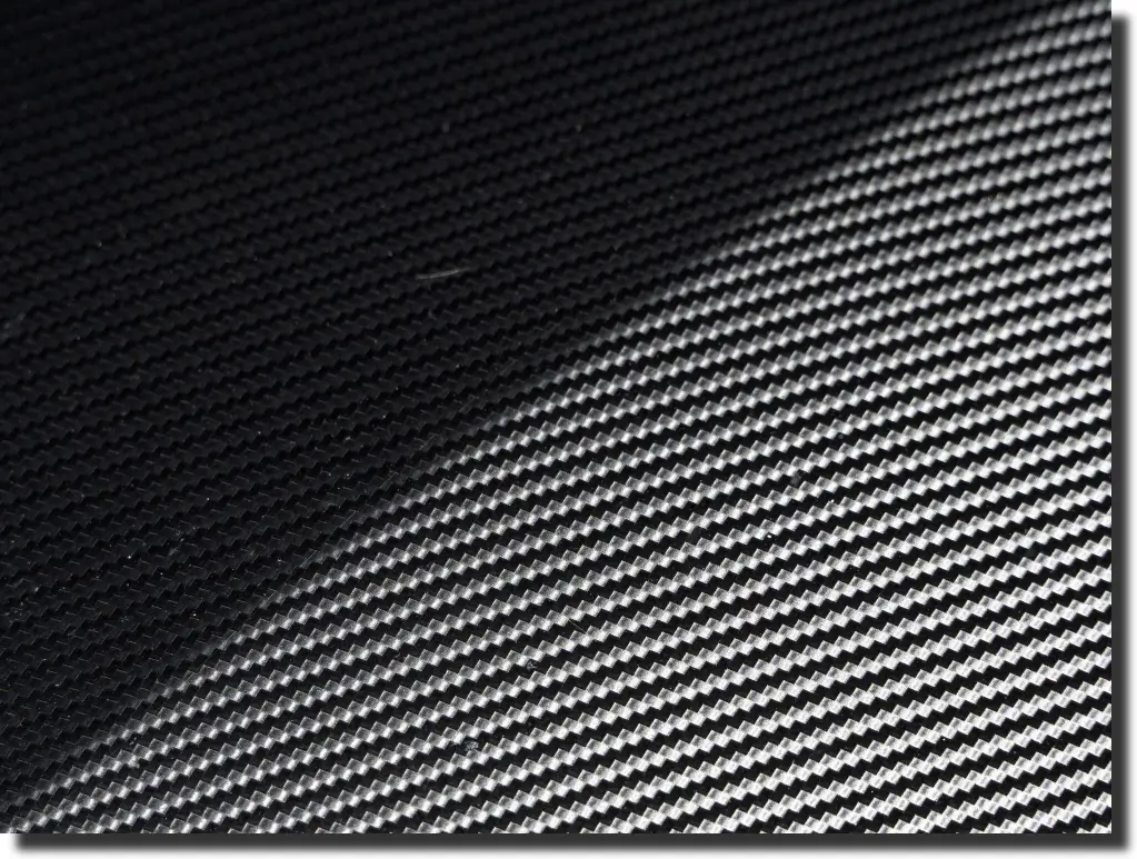 Close-up of carbon fiber sheet texture representing prepreg carbon fiber process control and repeatable laminate quality.
