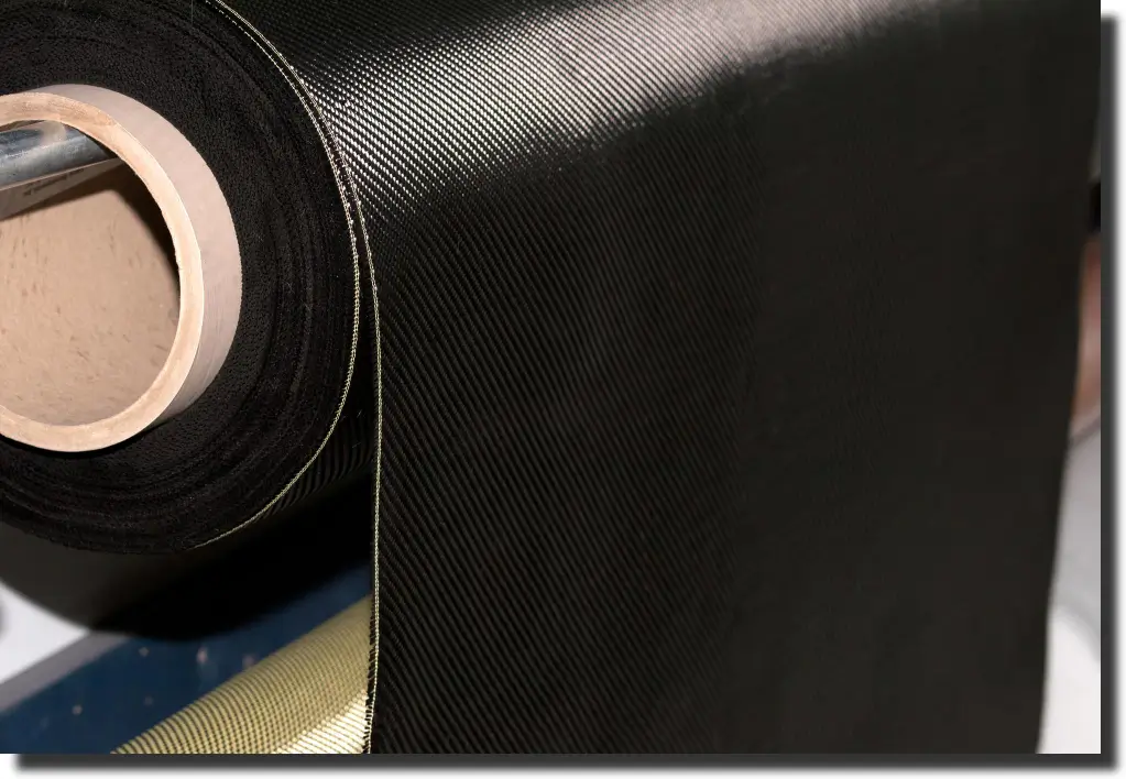 Roll of prepreg carbon fiber cloth showing controlled material used before layup, curing, trimming, and inspection.