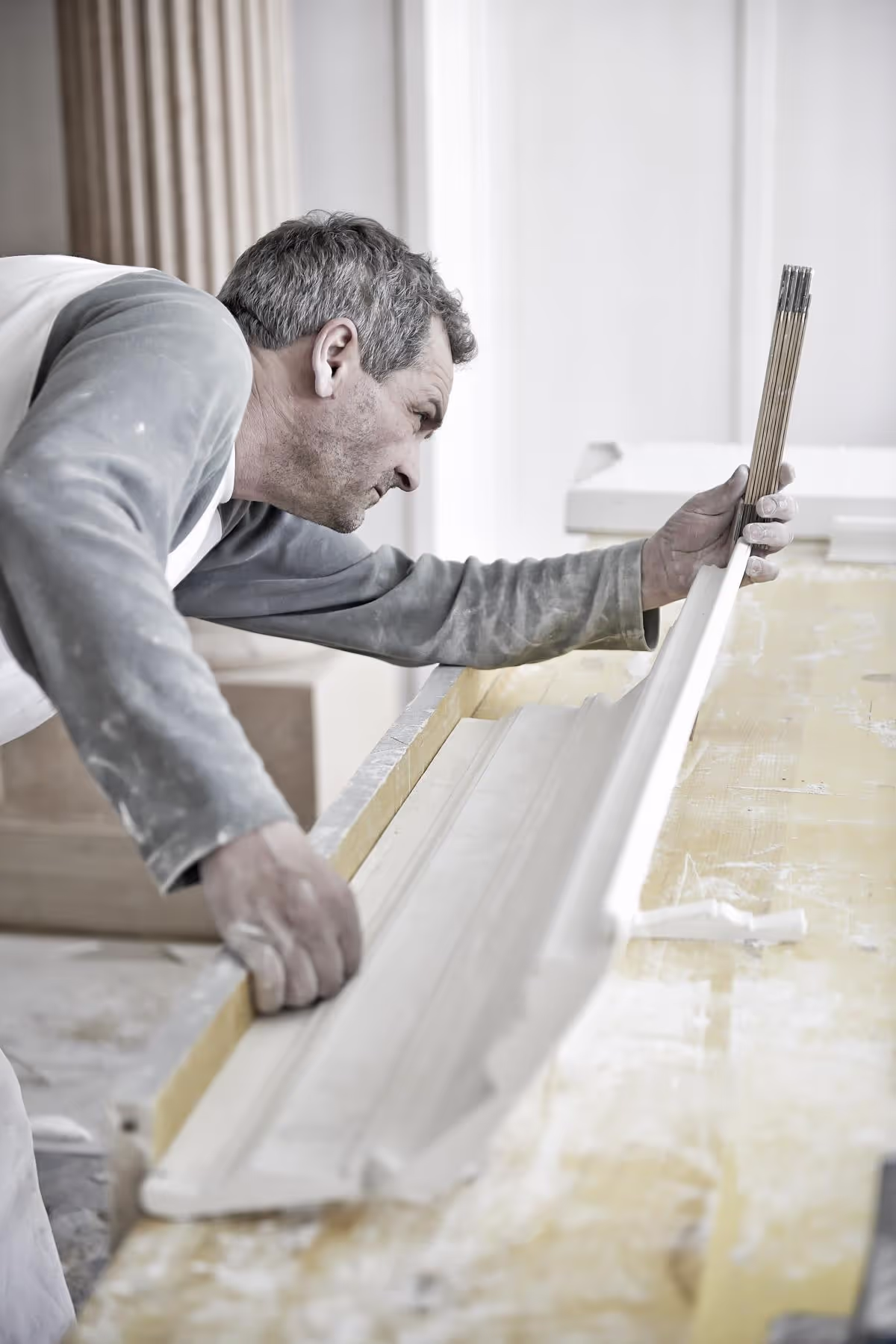 Craftsman working on a wooden surface.