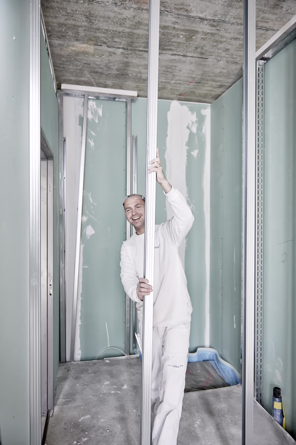 Photo of a construction worker standing in a doorway