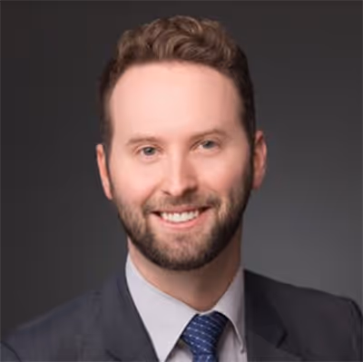 A professional headshot of Stuart Robertson.