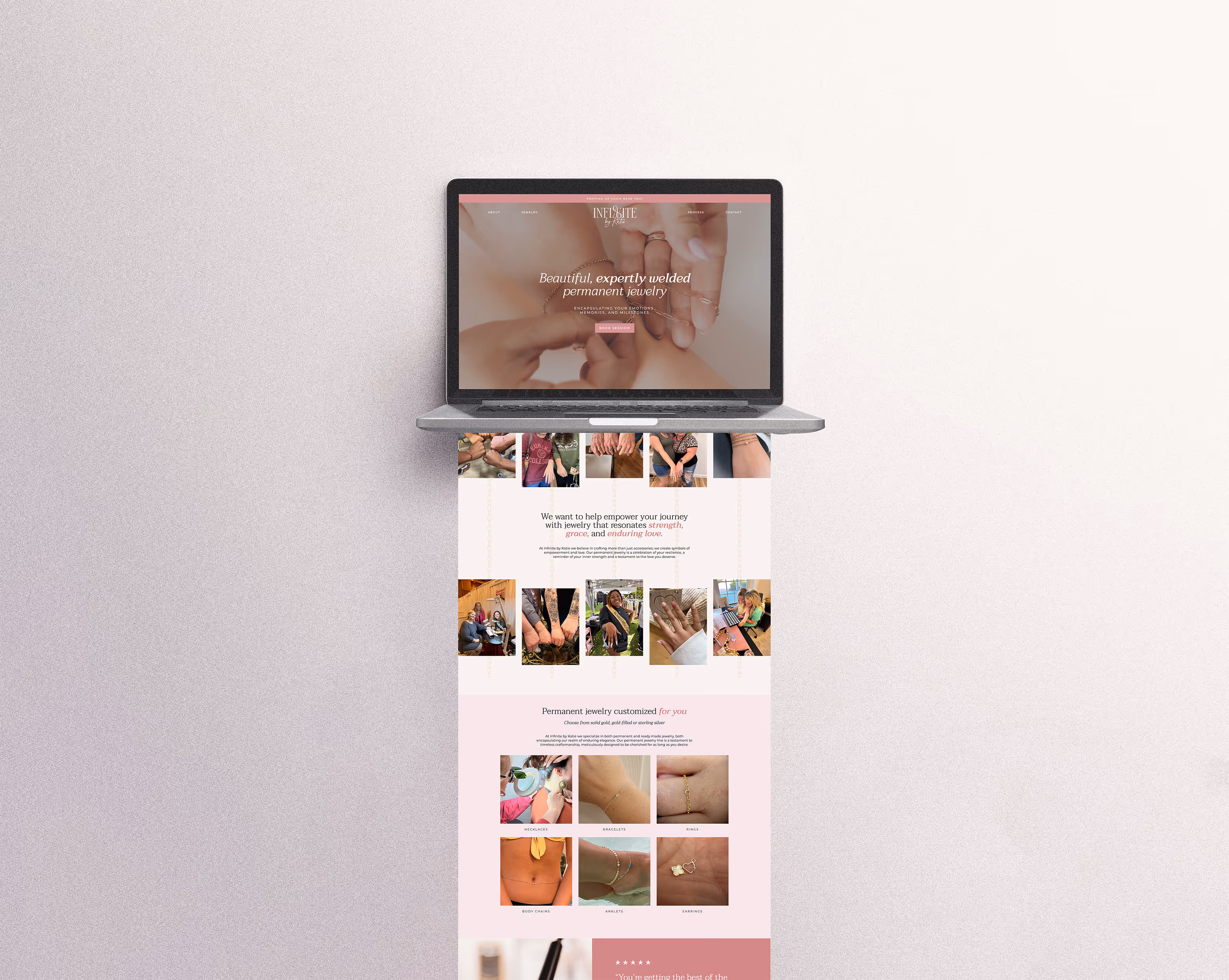 The landing page for Infinite by Katie, created by EQBM Design Company, mocked up with a laptop.