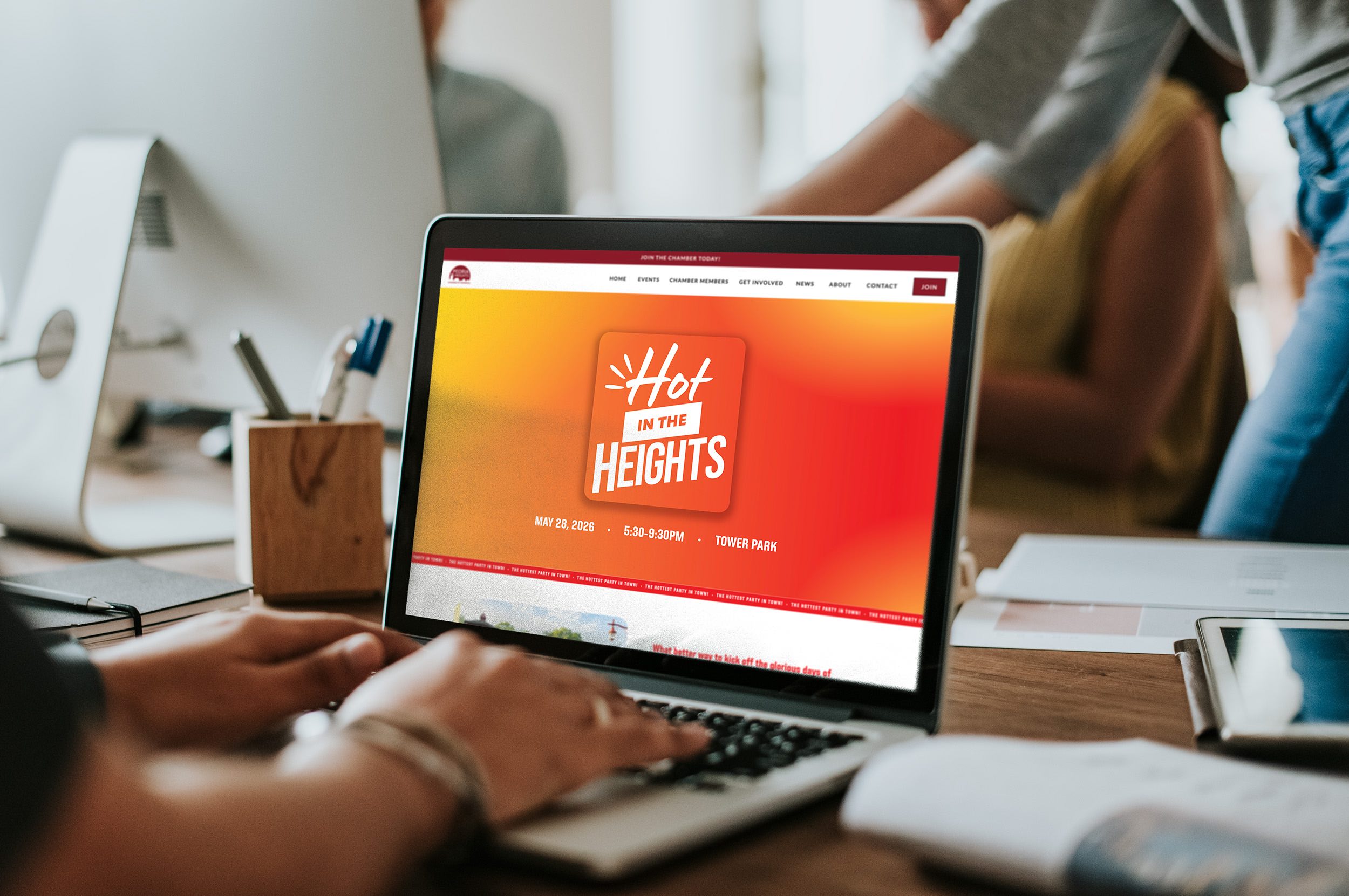A person viewing the website page for the Peoria Heights Chamber of Commerce annual event "Hot in the Heights".