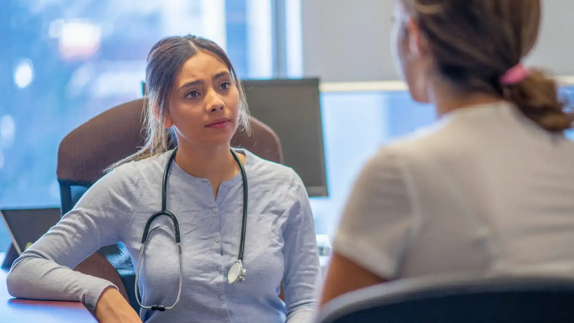 photo of nurse talking to a patient