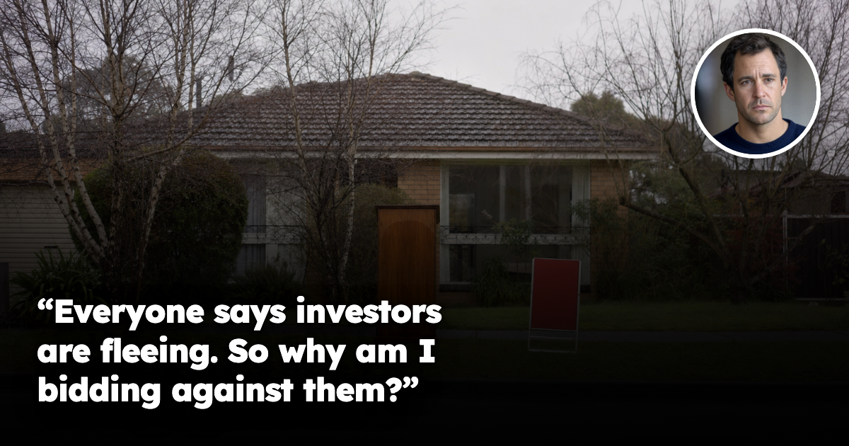 A lone auctioneer's portable wooden rostrum and a red auction sign standing on an empty suburban front lawn outside a brick-and-tile house on an overcast morning, with no bidders or onlookers present.
