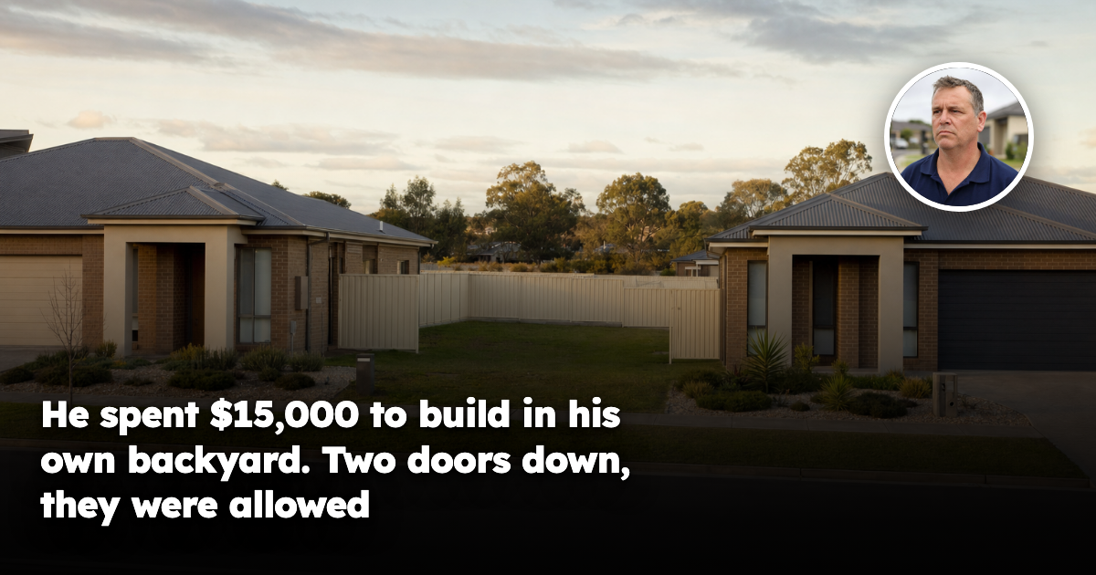 Two near-identical modern Australian suburban houses standing side by side on the same estate street, separated by matching cream Colorbond steel fencing, in late afternoon light.