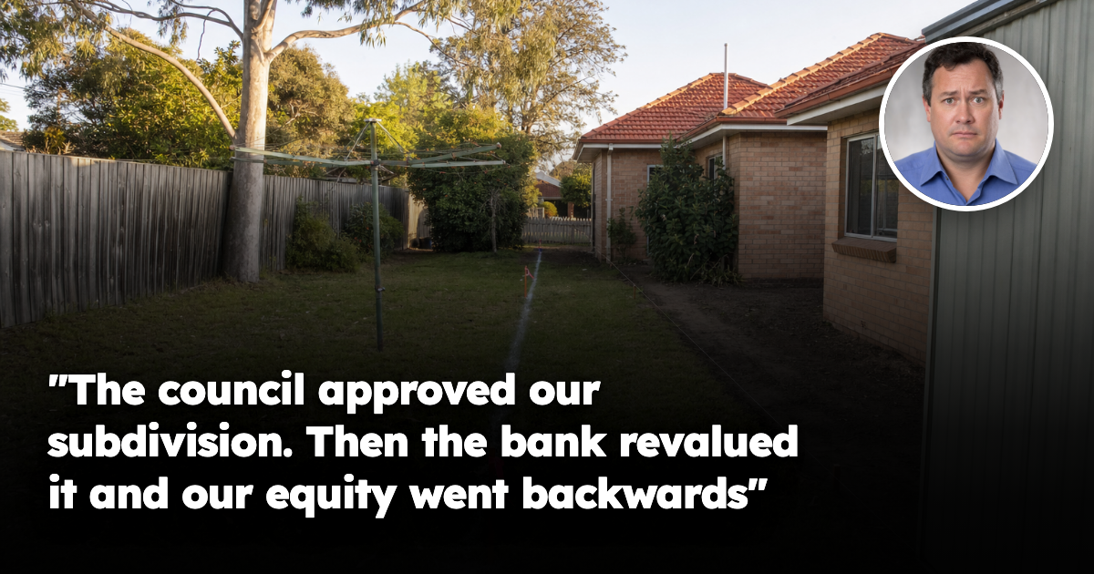 The back lawn of an older brick home on a large Australian suburban block, divided by fresh white surveyor's marking lines and orange pegs, with a narrow strip of bare dirt running down the side of the house.