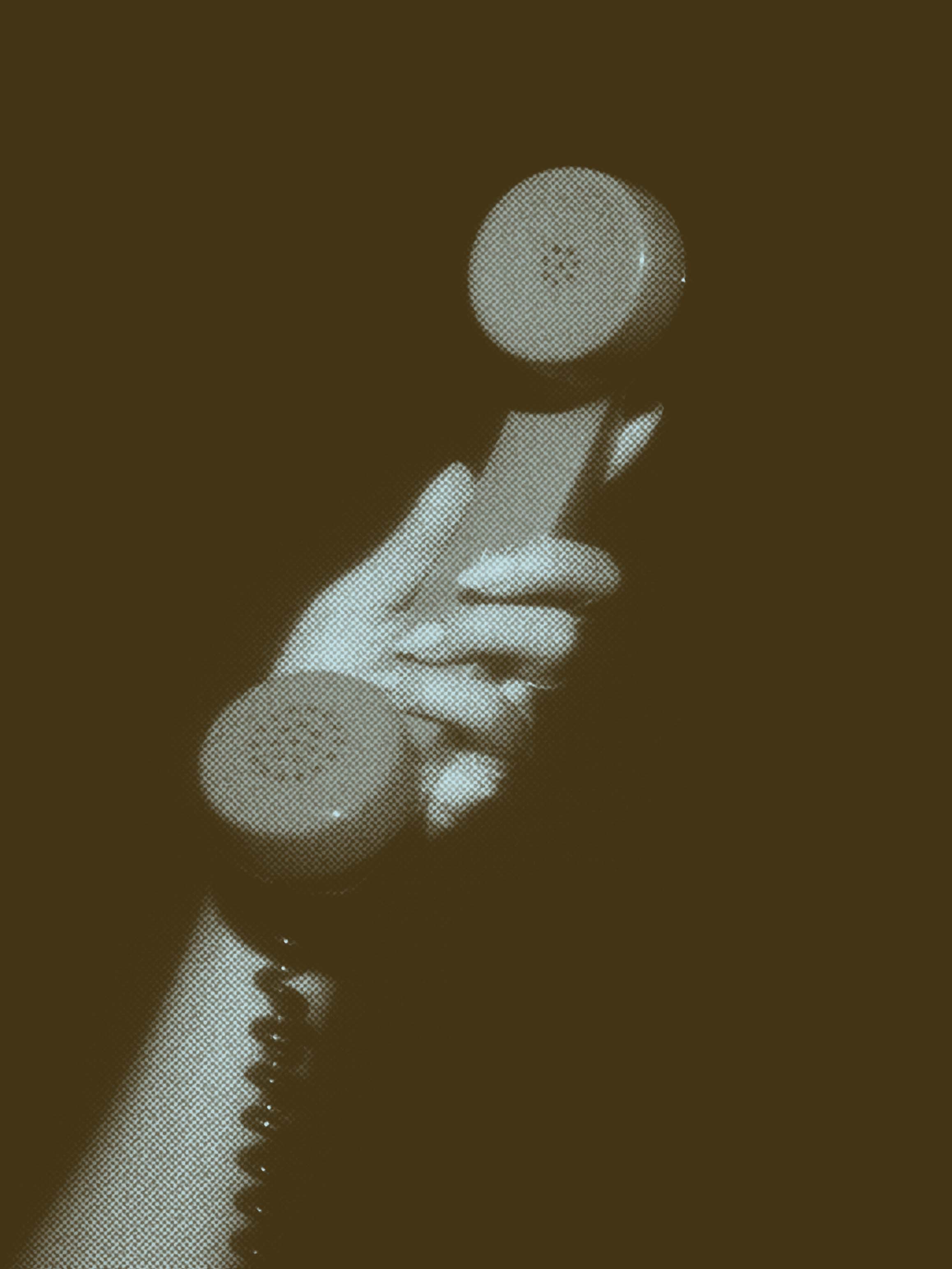 a hand holding up a phone