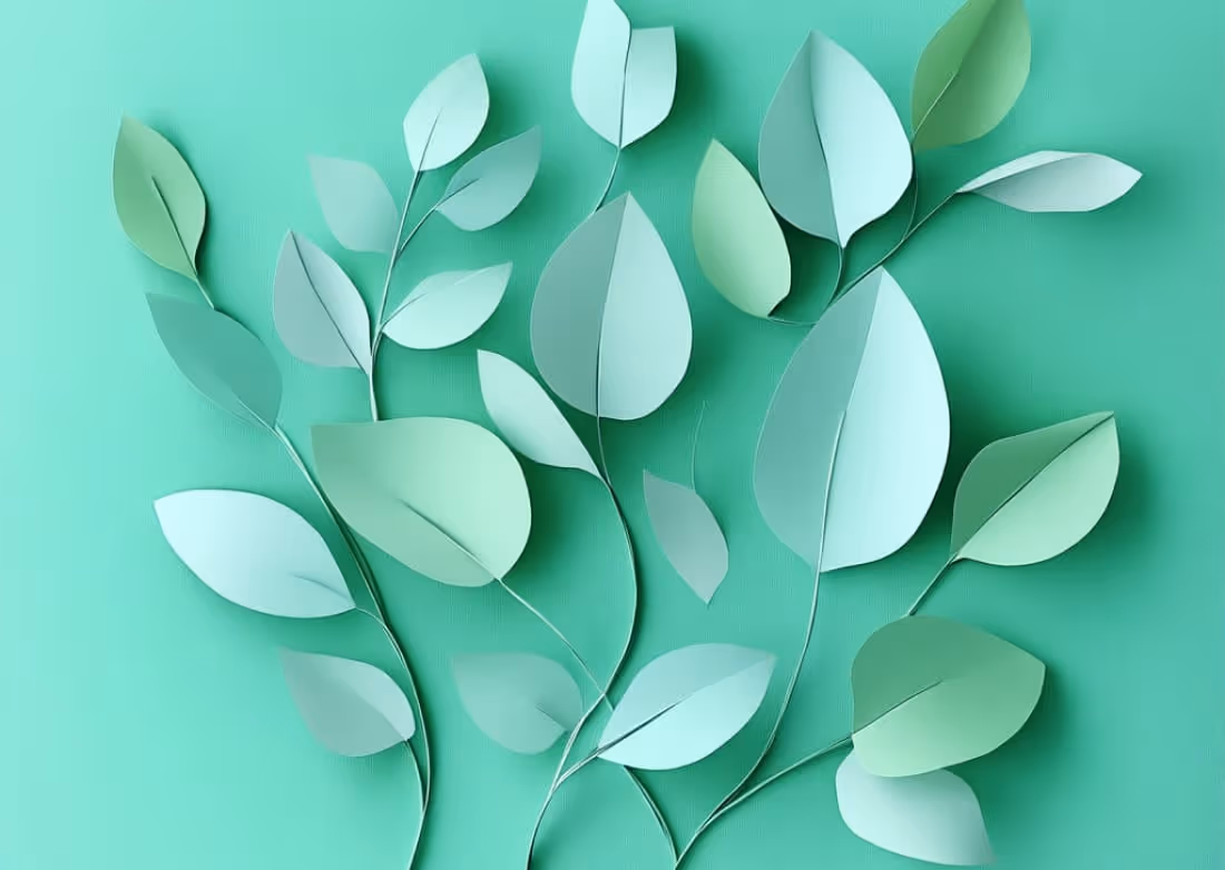 Papierkunst-Illustration grüner Blätter als Symbol für nachhaltige, umweltfreundliche Druckproduktion bei backesDruck.