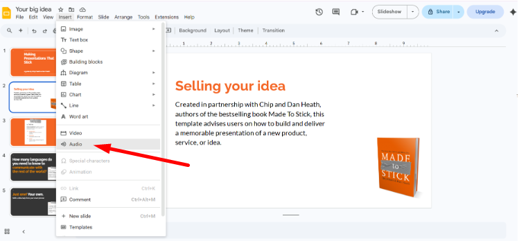 How to add music to Google Slides — Google Slides Insert menu open with the Audio option highlighted