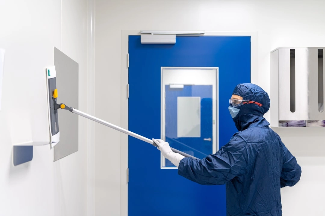 technician sanitizing high-touch surfaces in a home technician sanitizing high-touch surfaces in a home