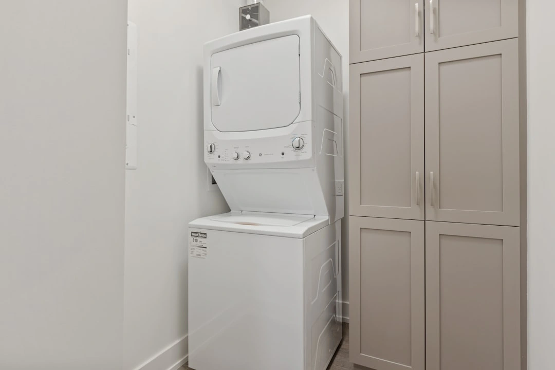 stackable washer and dryer unit in a tight apartment space