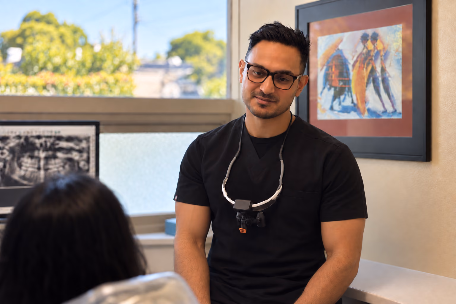 Dr. Shawn Sharma in black scrubs at Palo Alto Oral Health