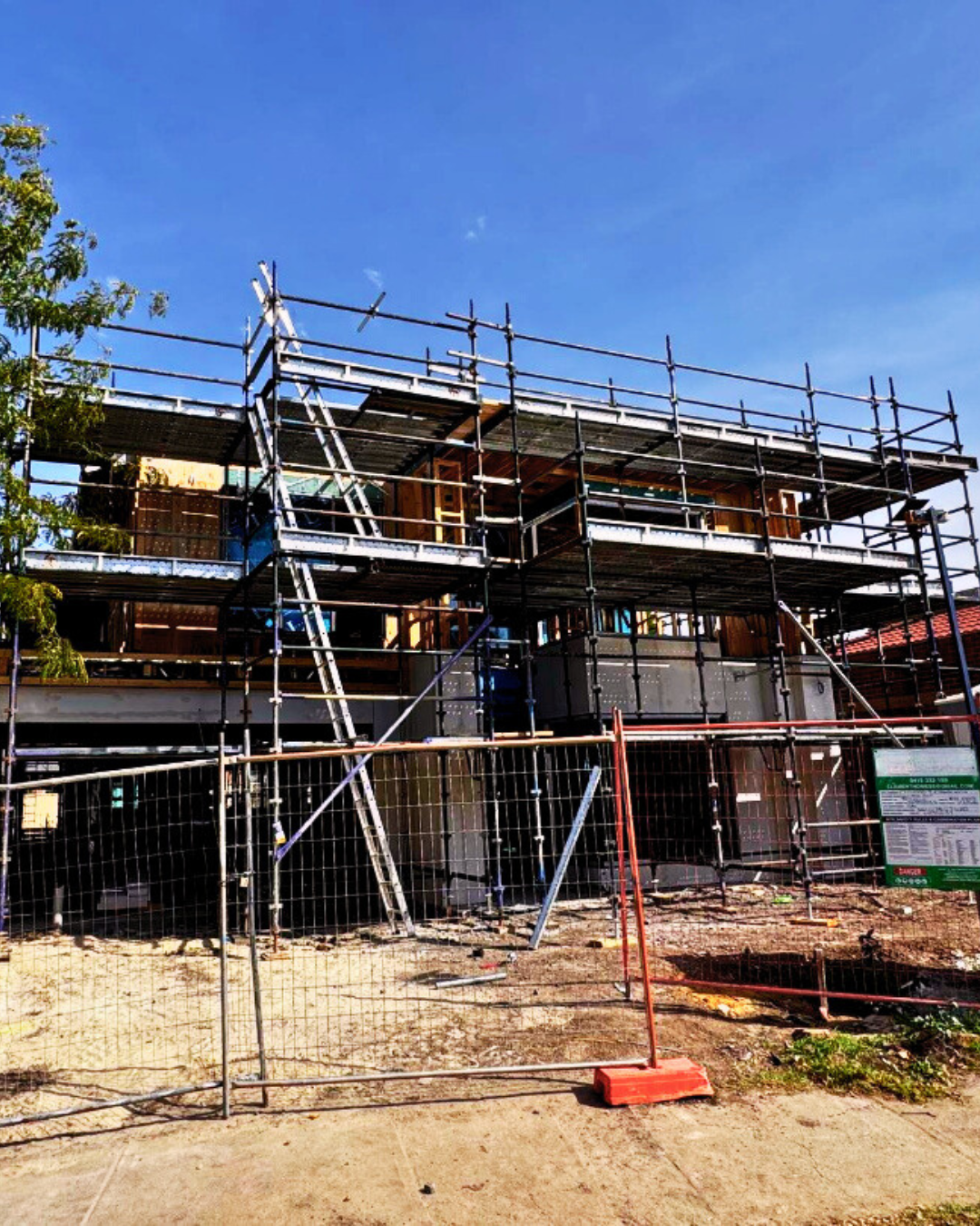 Two men standing on a construction site