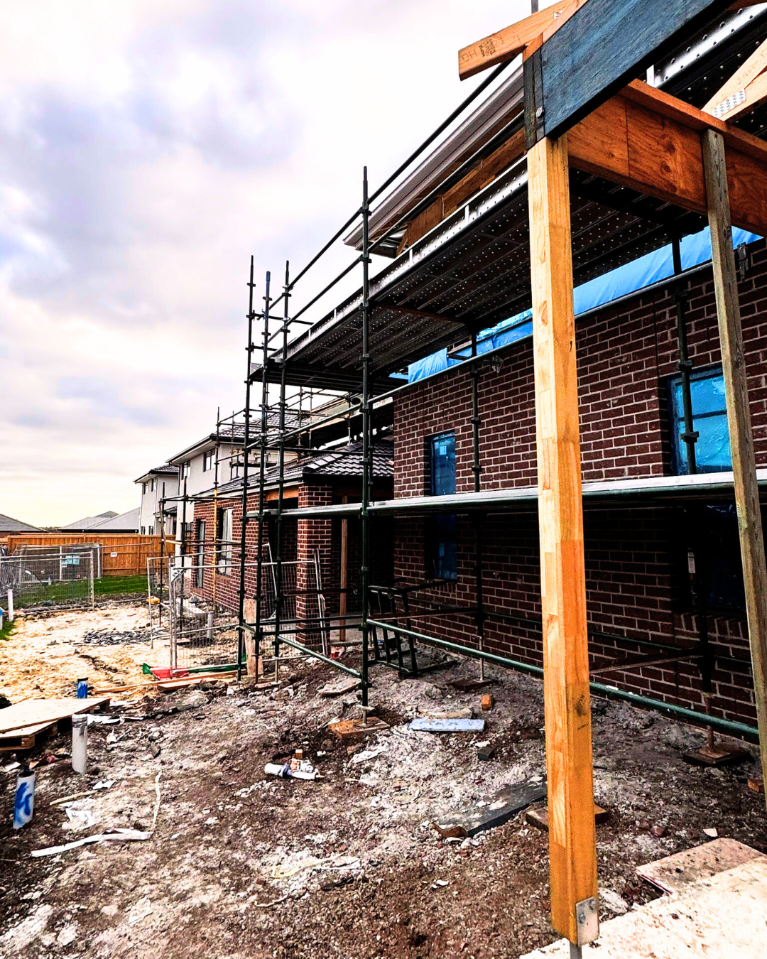 Scaffolding covering a building for construction