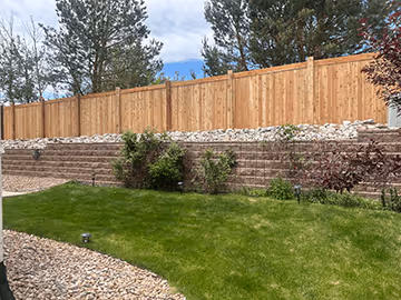 Wooden fence installation with patio floor