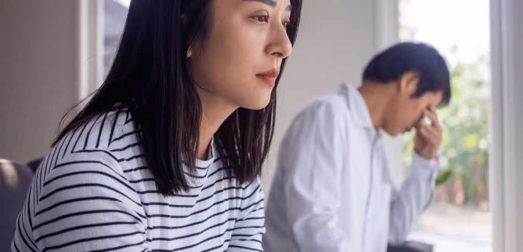 An Asian woman is stressed and anxious about the porn issue between her husband after an intense quarrel.