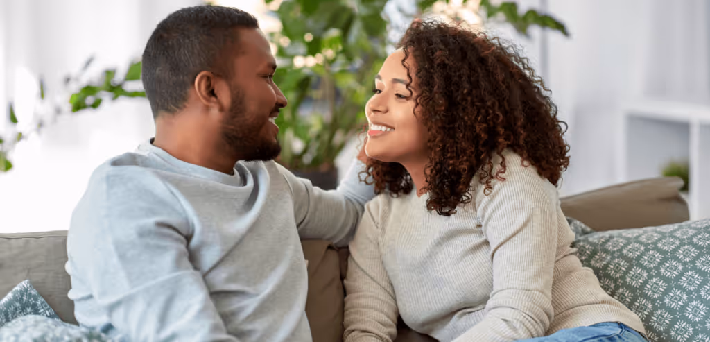 Romantic couple having healthy conversation on the sofa