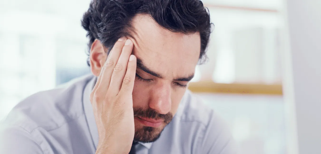 Man feeling down sitting alone