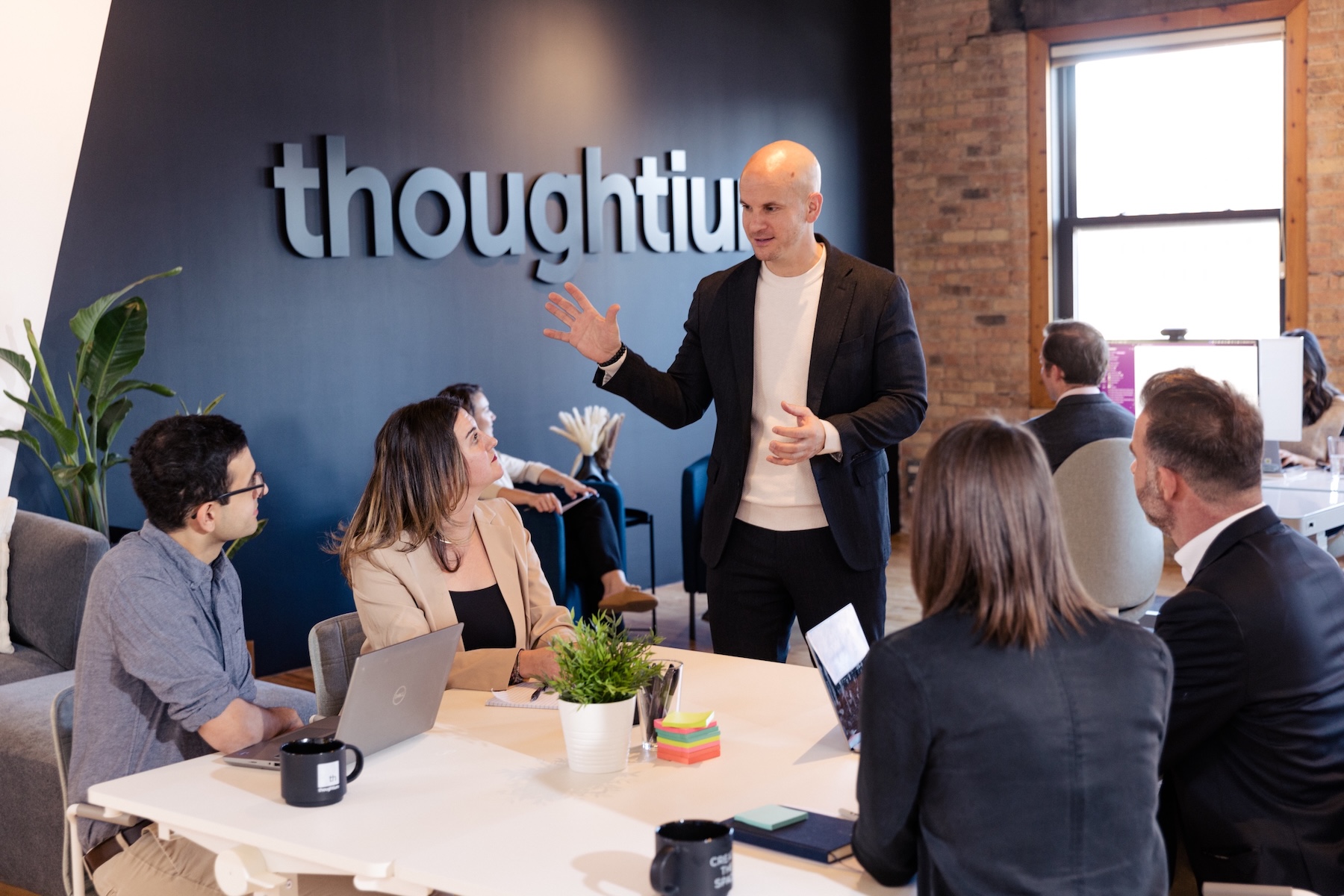 Group of team members in the Thoughtium office