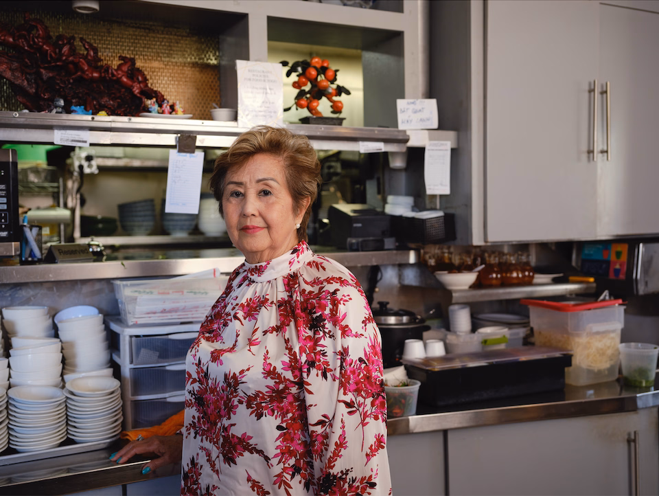 a woman standing in a kitchen