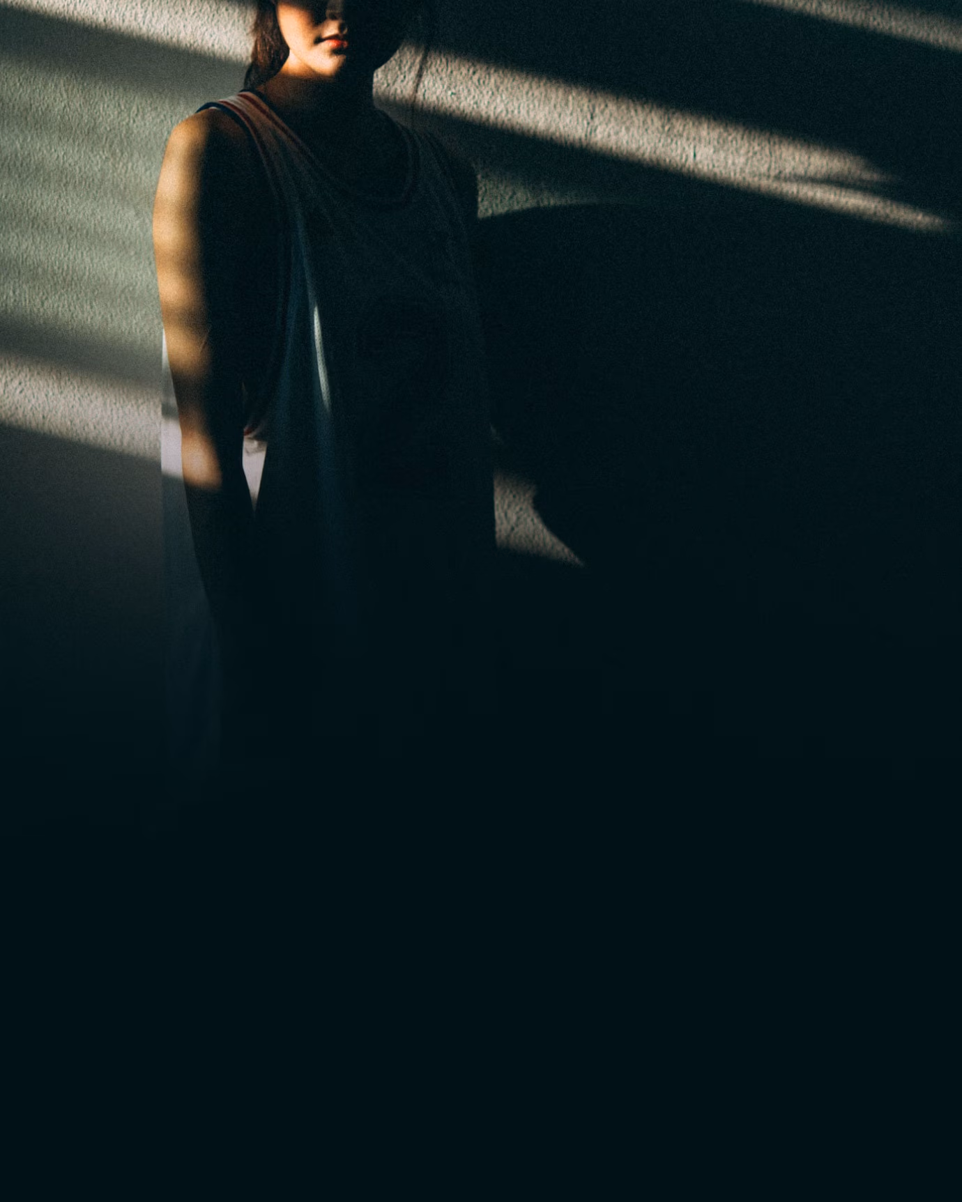 a person standing in a dark room