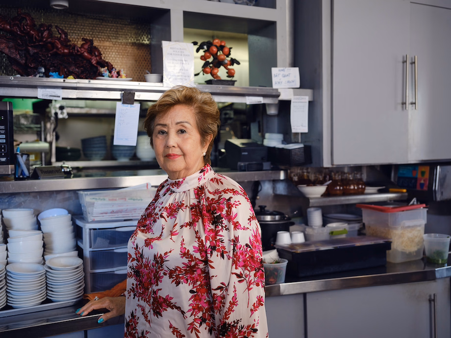 a woman standing in a kitchen