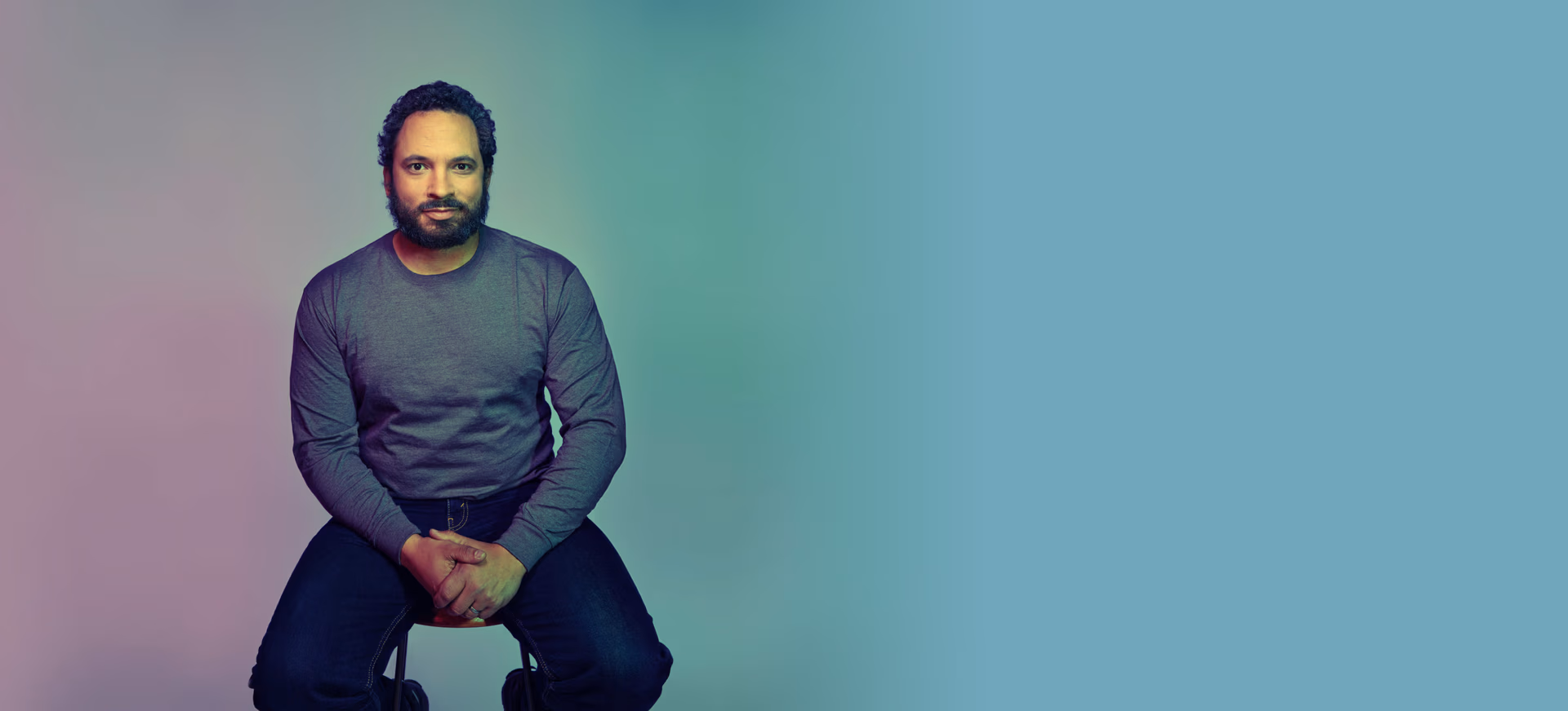 a man sitting on a stool
