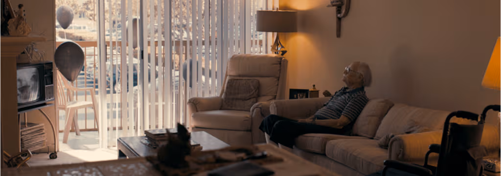 a person sitting on a couch in a living room