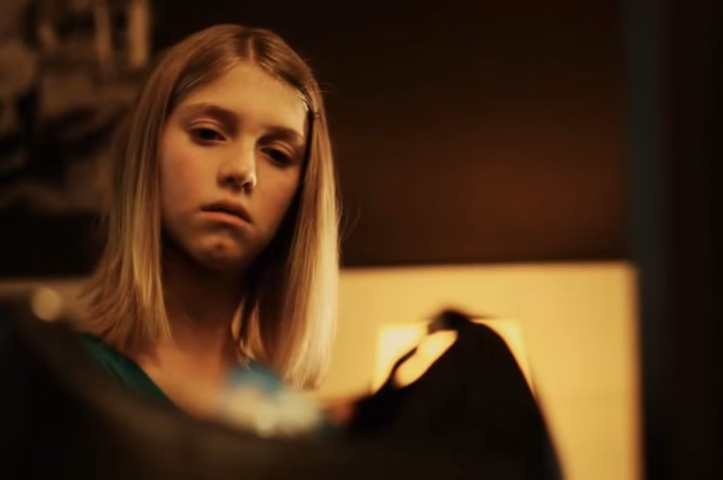 a girl looking down at something