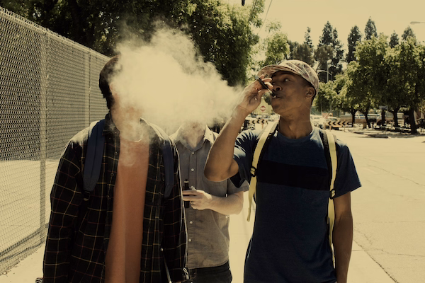 a man smoking a cigarette