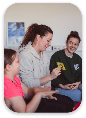 Therapy trainers having a reflective circle with kids